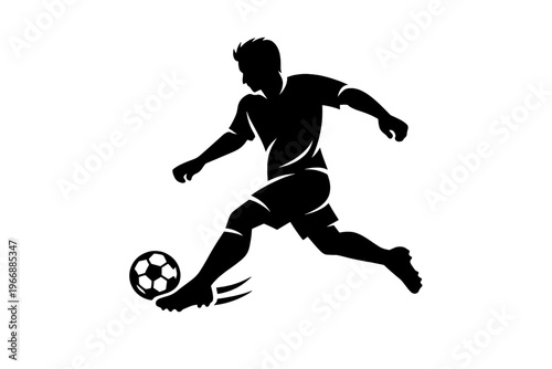 Silhouetted male soccer player kicking ball with dynamic movement