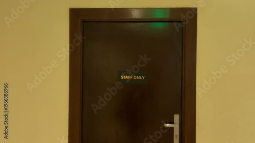 Secure Passage Reserved Exclusively For Employees In Beige Corridor With Security Features