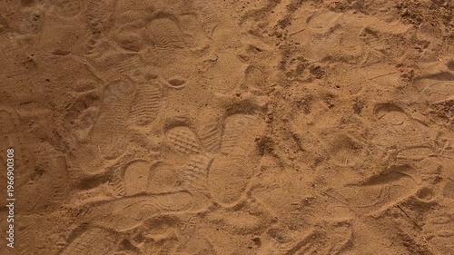 Footsteps Blend Into Sandy Shore. Marks Pressed Into Warm Sand Shape Coastal Scene Vividly