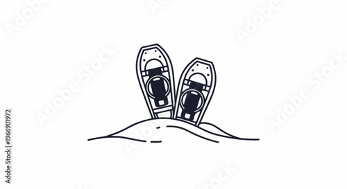 Pair of snowshoes standing upright in snow drift