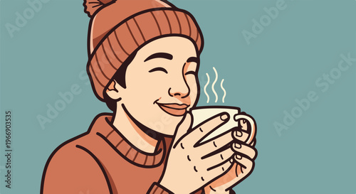 Person in beanie and sweater enjoys a warm drink