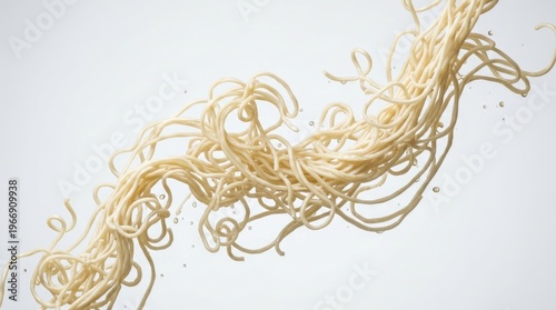 Tangled noodles fly through air in a chaotic motion on a plain background