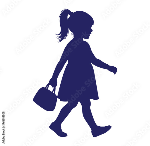 Silhouette of a little girl walking with a lunchbox in her hand