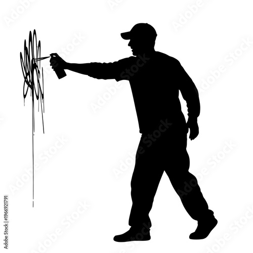 Silhouette of a Graffiti Artist Spraying Paint on a Wall.