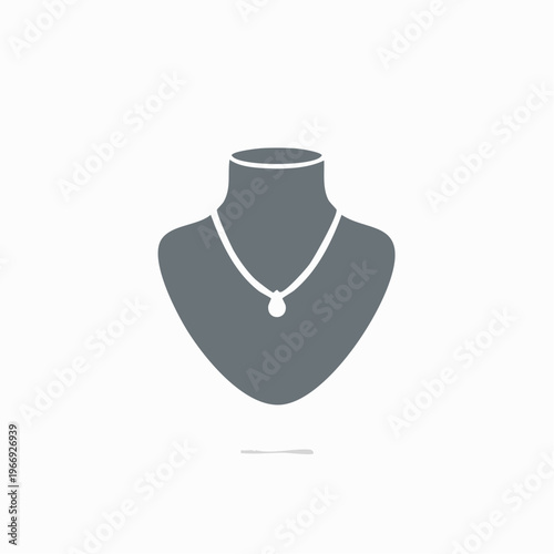 Elegant Necklace Displayed on a Mannequin in Minimalist Style