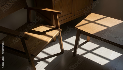 Empty wooden tables and chairs arranged in a modern restaurant interior with a clean floor and elegant dining design