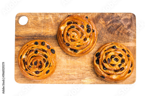Danish raisin pastry swirls isolated on white background. top view