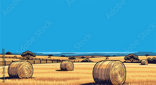 Rural landscape with hay bales under a clear blue sky