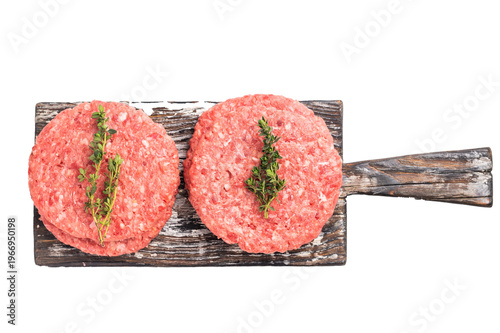 Raw pork and beef meat patties with herbs on wooden board isolated on white background