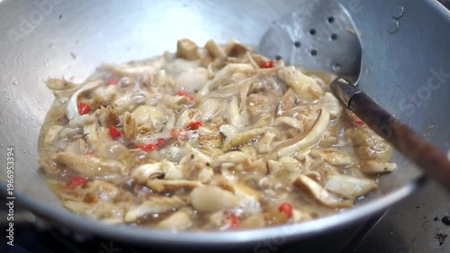 Wallpaper Mural Natural fresh mushrooms or their Latin name Macrolepiota albuminosa, are being cooked in a pan with red chili peppers, organic food ingredients. Torontodigital.ca