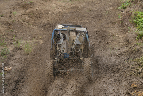 Red Pickup off road  4WD spin mud dirty track on mountain hill.     