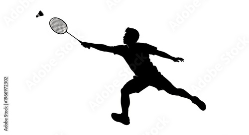 Silhouette of a man playing badminton hitting shuttlecock.