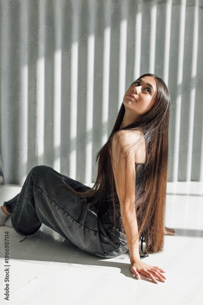 Naklejka premium A stylish photo shoot for a girl. Loft interior