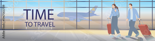 Young couple walking through an airport terminal with suitcases, heading for departure. Travel and tourism concept with panoramic windows and airplanes in the background.