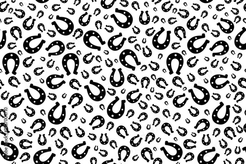 Silhouette of a lucky horseshoe. Seamless vector horizontal pattern. Endless animal print.