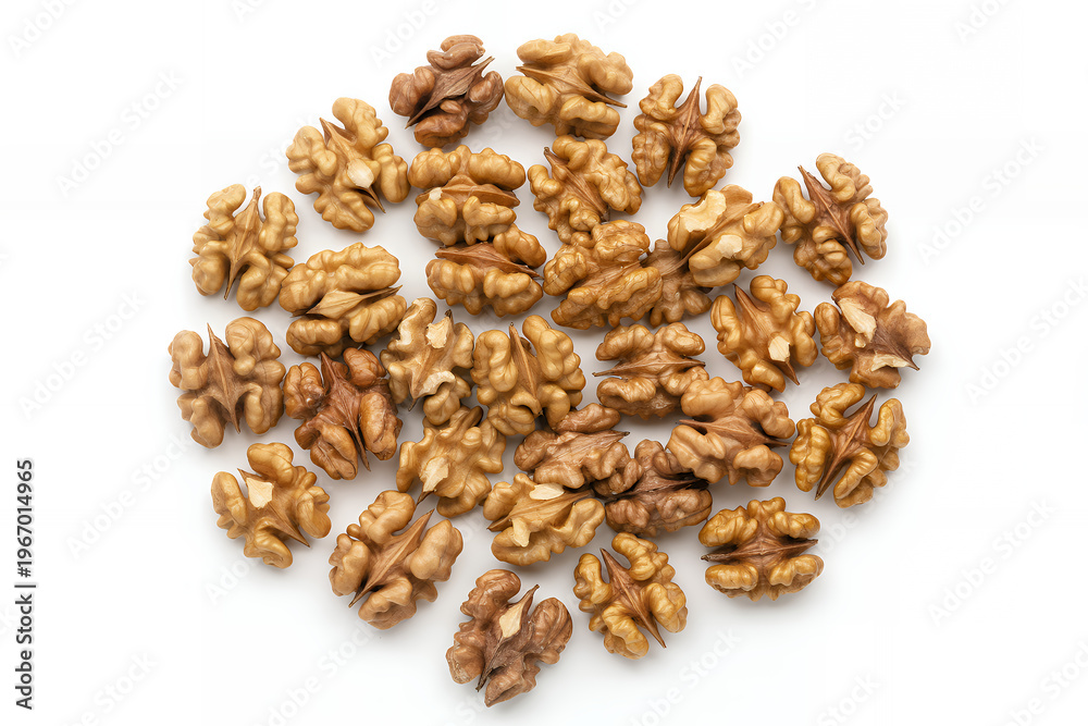 Obraz premium Loose walnuts on white background scattered brown