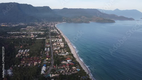 Aerial 4K wide view of Maresias beach coastline and mountains in Sao Sebastiao, Brazil