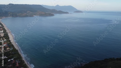 Aerial 4K wide view of Maresias beach coastline and mountains in Sao Sebastiao, Brazil
