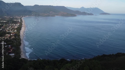 Aerial 4K wide view of Maresias beach coastline and mountains in Sao Sebastiao, Brazil