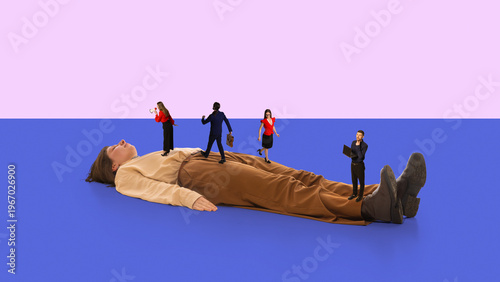 Woman in office outfit lying on floor with miniature professionals walk across her body on minimal background. Concept of workload stress, career pressure, and emotional exhaustion in corporate life.