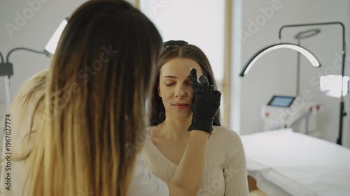 Pre microblading consultation and eyebrow mapping in modern beauty clinic