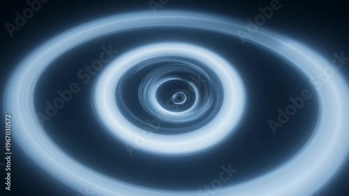 Glowing blue rings swirl in a mesmerizing pattern on a dark background