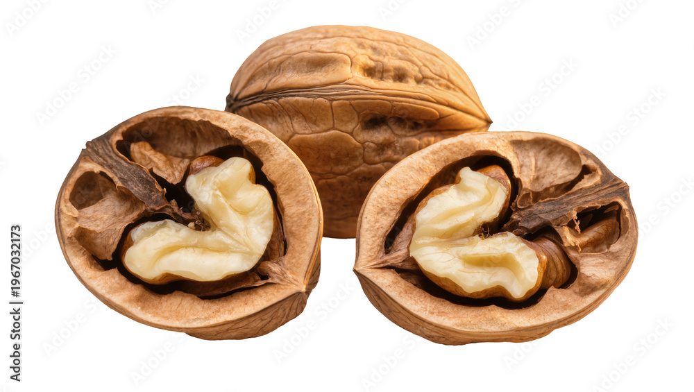 Obraz premium Whole and halved walnuts with creamy white kernels, isolated on transparent background