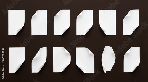 Collection of white paper sheets with various curled corners and realistic shadows on a dark background.