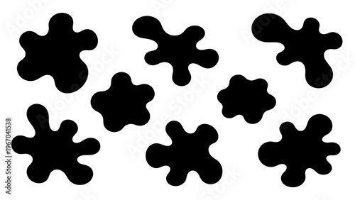 Abstract black inkblot shapes on a white background for artistic and graphic design use