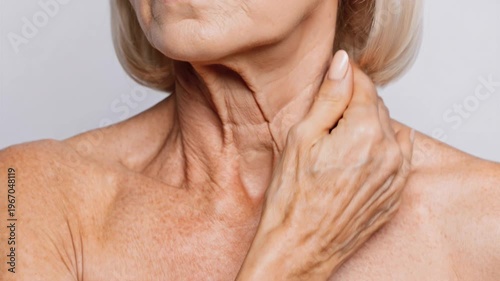 Close up of an older woman’s neck showing wrinkles and skin aging concerns.