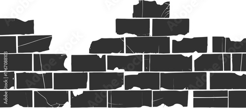 A broken brick wall with damaged and crumbling black bricks and mortar
