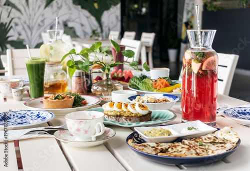 mixed western healthy food meal on restaurant table outdoors in singapore restaurant