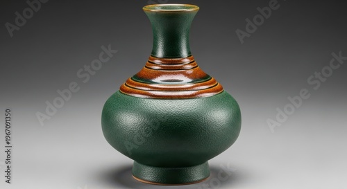 Elegant green and brown speckled ceramic vase with flared rim and narrow neck