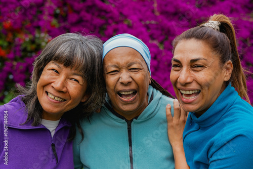 Group of happy multiracial women having fun together at city park after yoga retreat - Elderly people friendship, healthy lifestyle and multicultural concept