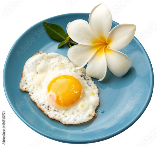 Fried egg with frangipani flower on a blue plate.