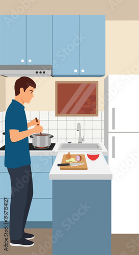 A man in a blue shirt standing and cooking food in a modern home kitchen area