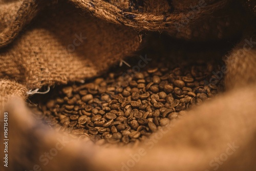 Canvastavla Dark Roast coffee and a scoop on a rustic background on burlap