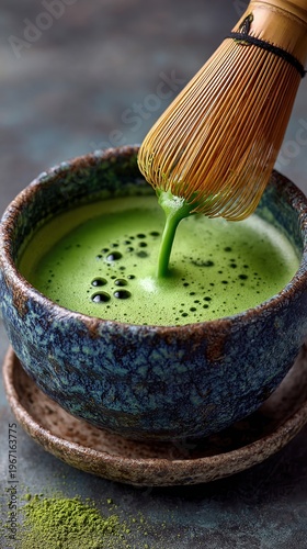 Whisking Green Matcha Tea in Traditional Japanese Bowl with Whisk