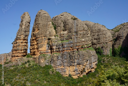 Mallos de Riglos rock formations in Huesca, Spain with dramatic cliffs and blue sky