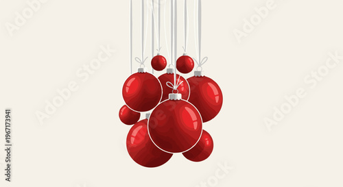 Festive red baubles hanging by white threads against a light background
