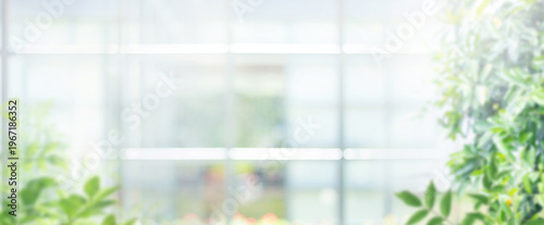 Big window glass building with blur greenery