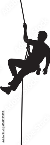 Black silhouette of a man rappelling down a rope climbing