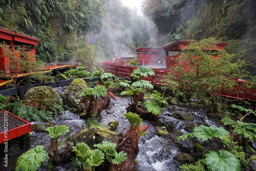 Volcanic hot springs Termas Geométricas nestled in native forests and river valley near the active Villarrica volcano, Pucon, Chile