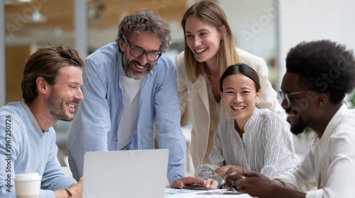 Workplace Harmony: A group of colleagues, bound by a spirit of collaboration, gathers around a laptop, immersed in a moment of teamwork. Their faces, alight with smiles.