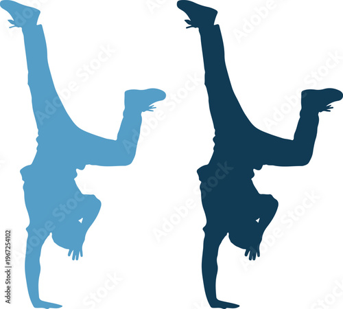 Two people doing handstands in blue silhouette