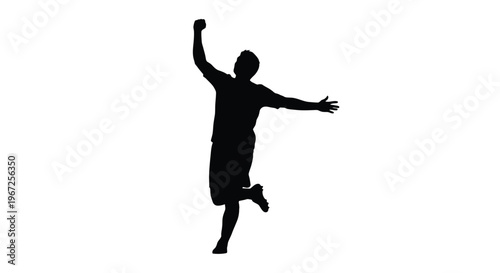 Joyful man jumping with arms raised in a dark silhouette