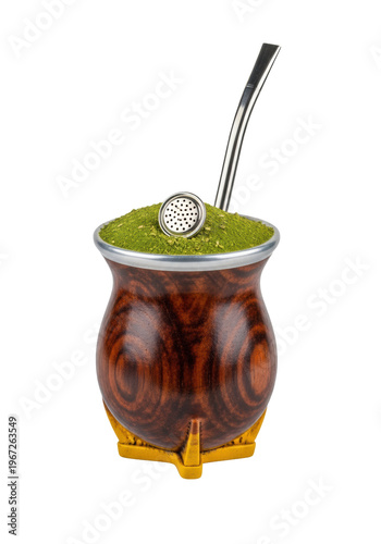 Traditional south american mate gourd made of dark wood with a silver bombilla, isolated on a white background. Concept for beverage advertising