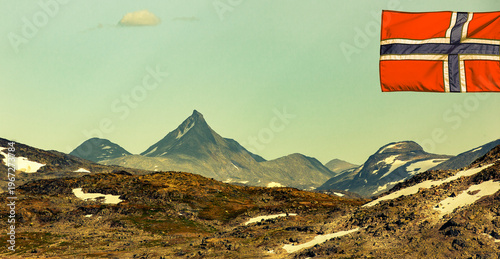 Mountain panorama in Jotunheimen with Norwegian flag