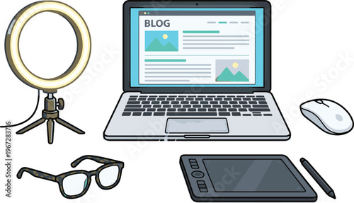 A blogger sets up equipment including a laptop, graphics tablet, and ring light for creating digital content.