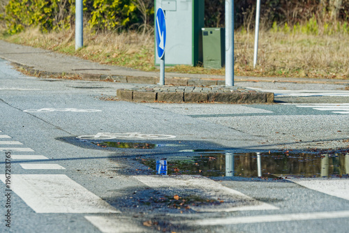 Fotografie Urban street intersection with pedestrian crossing and bicycle lane markings
